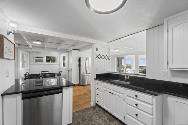 kitchen featuring white cabinets, stainless steel appliances, and sink