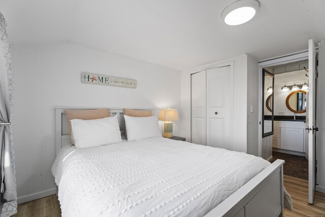 bedroom featuring a closet and dark wood-type flooring