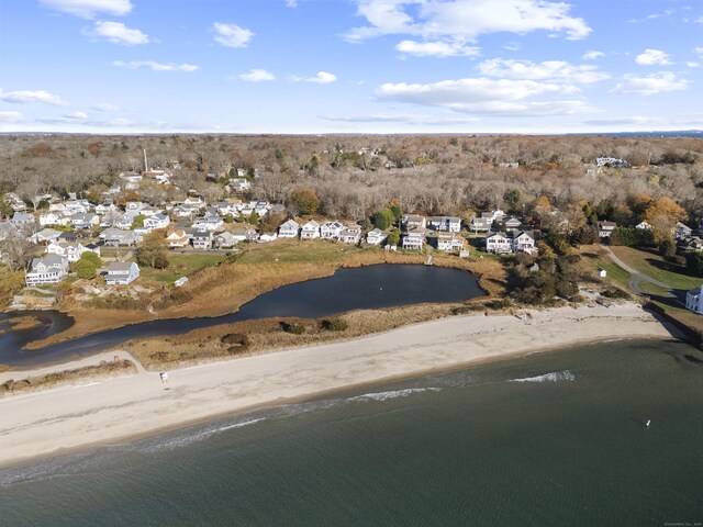 drone / aerial view featuring a view of the beach and a water view