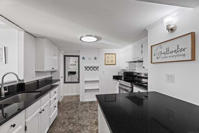 kitchen featuring white cabinetry, sink, and stainless steel range with electric cooktop