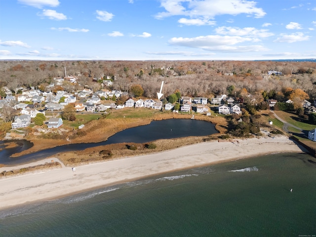 birds eye view of property featuring a view of the beach and a water view