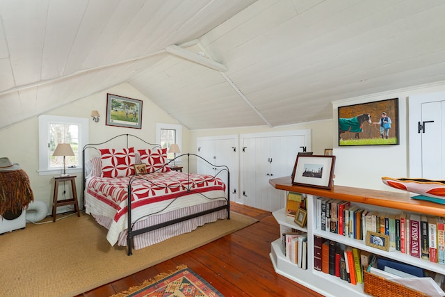 bedroom with hardwood / wood-style floors, wood ceiling, and vaulted ceiling