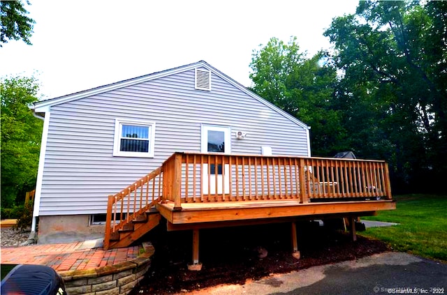 back of house featuring a wooden deck