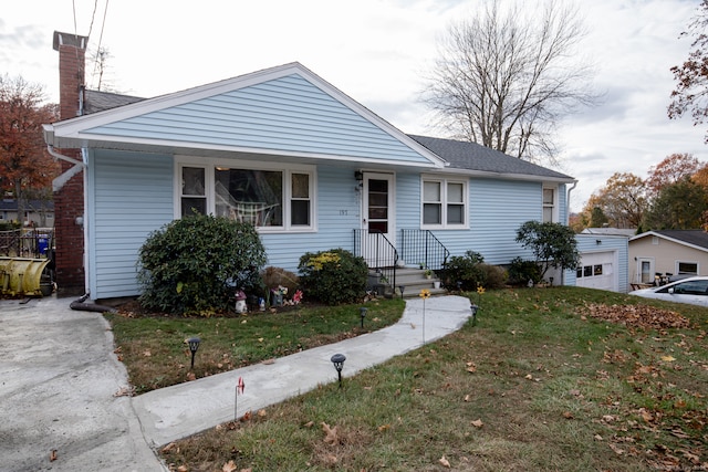 bungalow with a garage and a front yard