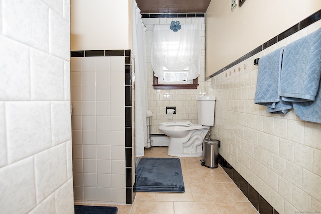 bathroom with tile walls, toilet, and tile patterned floors