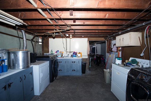 basement with washer and clothes dryer