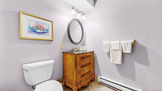 bathroom featuring a baseboard radiator, vanity, and toilet