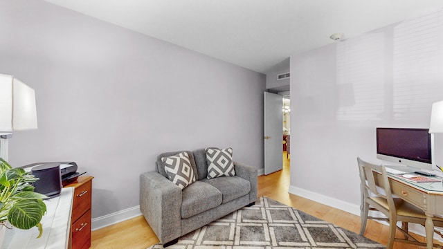 office area with hardwood / wood-style floors