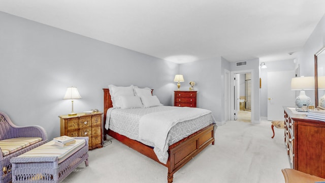 carpeted bedroom with ensuite bathroom