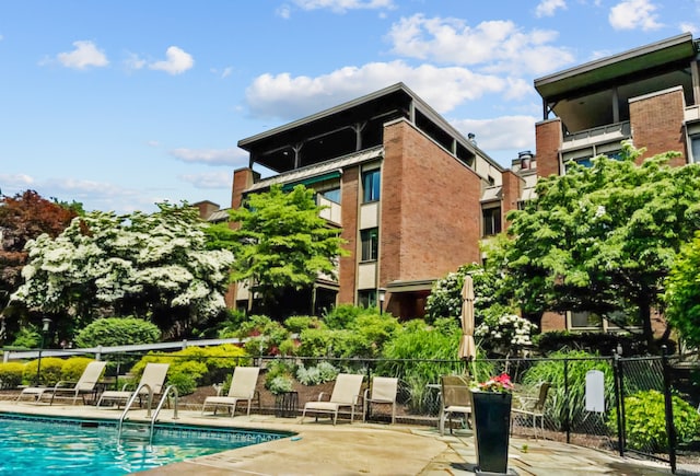 view of swimming pool featuring a patio area