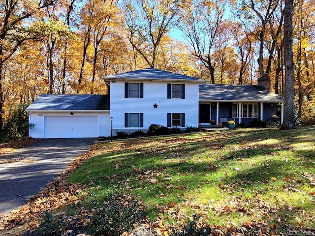 view of front facade featuring a garage and a front lawn