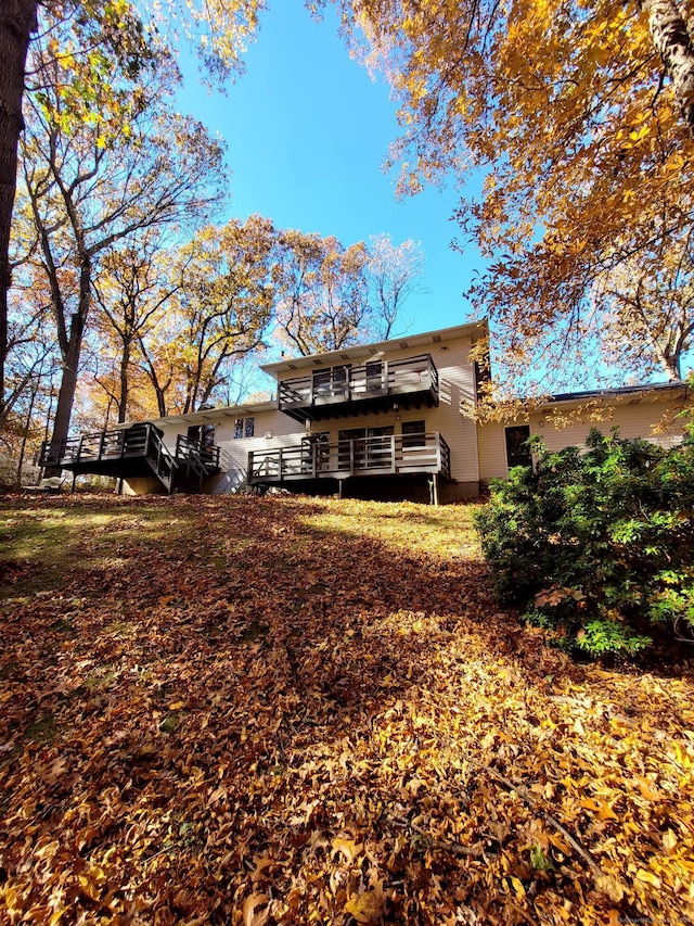 back of house featuring a deck