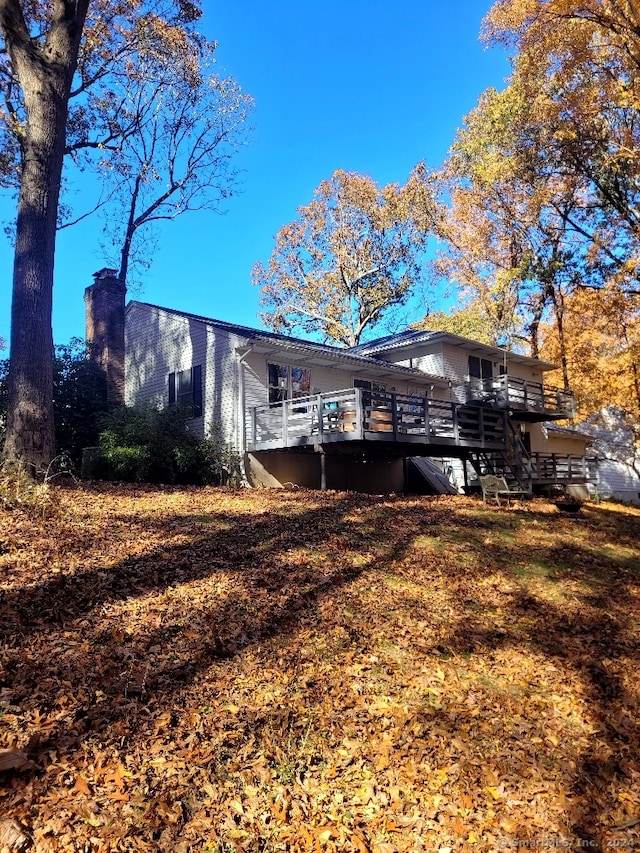 rear view of property with a deck