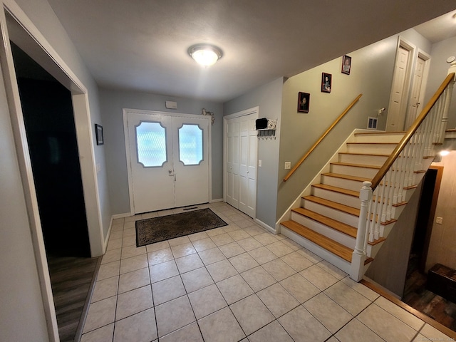 tiled entrance foyer with french doors