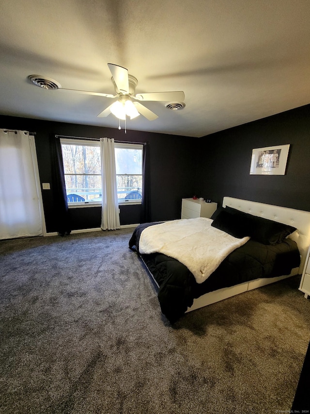 carpeted bedroom with ceiling fan