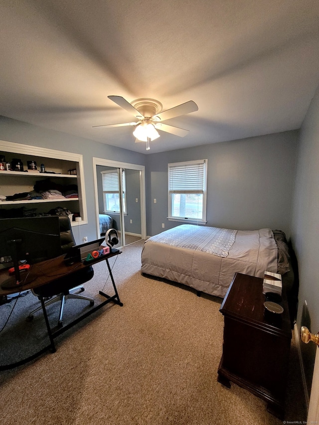 carpeted bedroom with ceiling fan