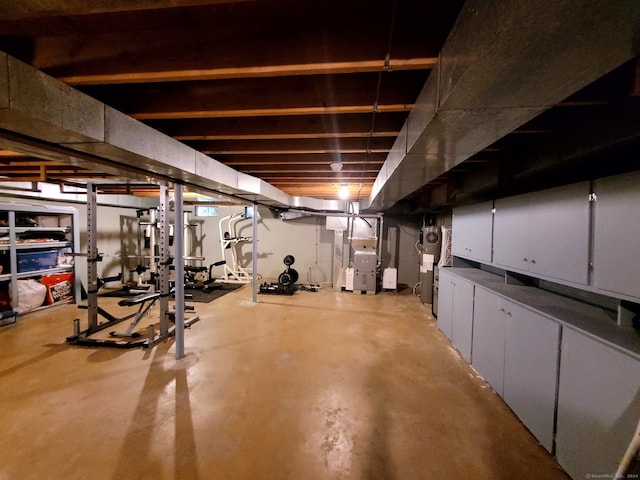 basement with heat pump water heater and heating unit