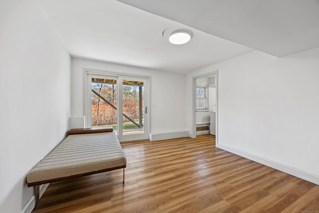 unfurnished room with hardwood / wood-style floors