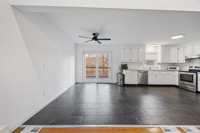 kitchen with backsplash, ceiling fan, white cabinets, and appliances with stainless steel finishes