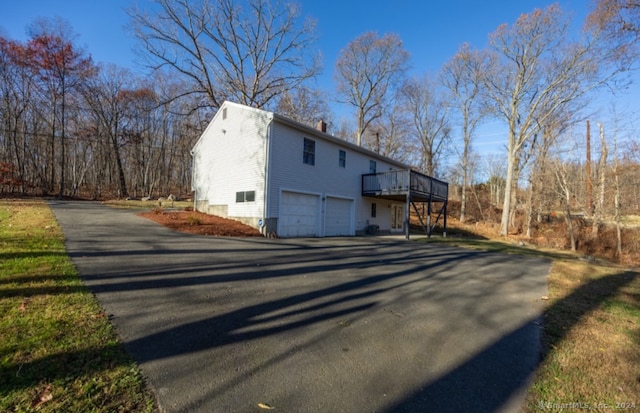 view of side of home with a garage