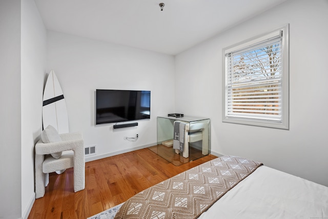 bedroom featuring hardwood / wood-style floors