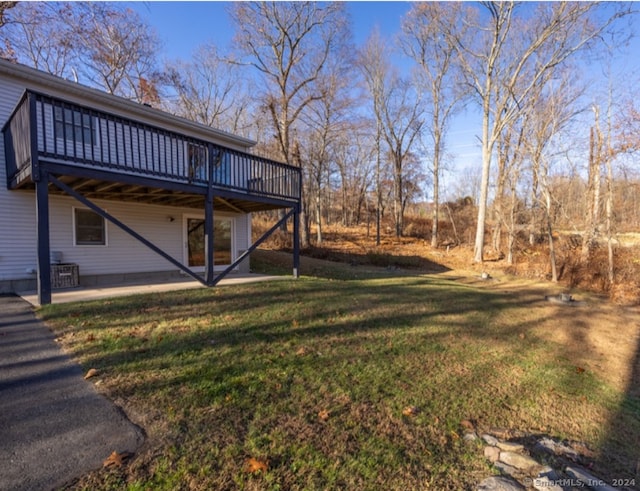 view of yard featuring a wooden deck