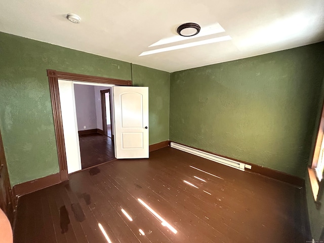 empty room featuring dark hardwood / wood-style floors