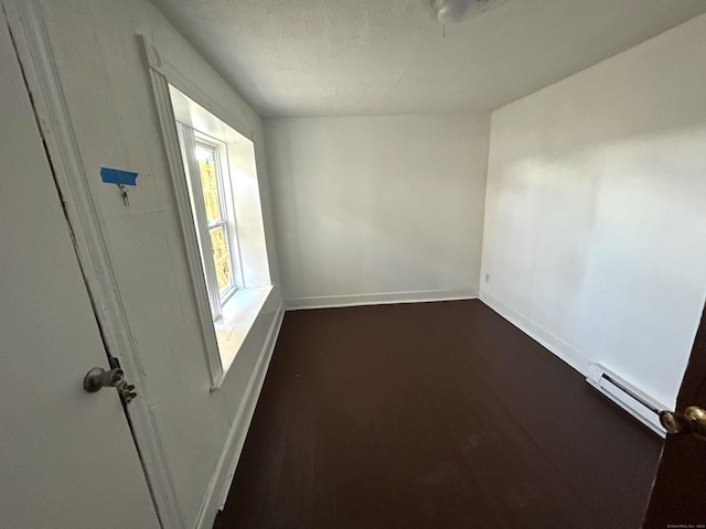 spare room with baseboard heating