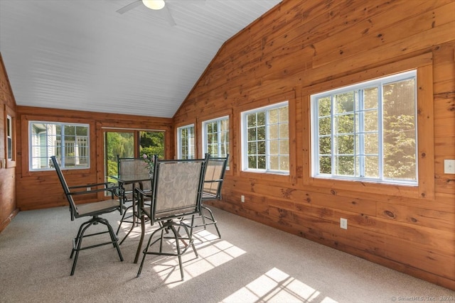 unfurnished sunroom with vaulted ceiling and ceiling fan