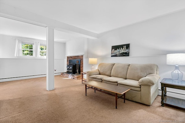 living room with a wood stove and carpet flooring