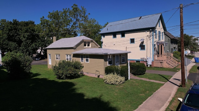 exterior space featuring a lawn