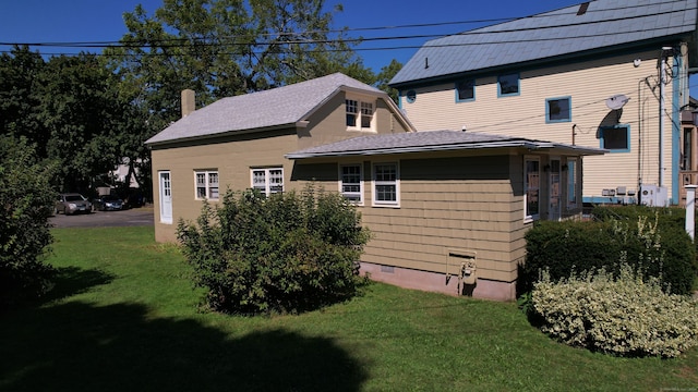 view of home's exterior featuring a lawn