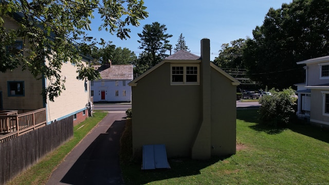 view of property exterior featuring a yard