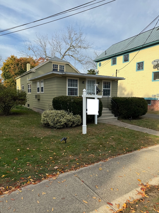 view of front of property with a front lawn