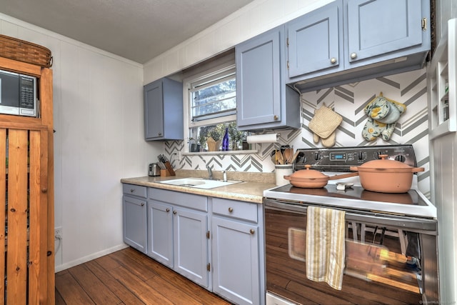 kitchen with range with electric cooktop, sink, and dark hardwood / wood-style floors