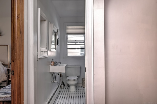 bathroom with tile patterned flooring and toilet