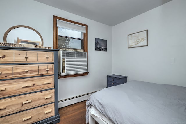 bedroom with cooling unit, baseboard heating, and dark wood-type flooring