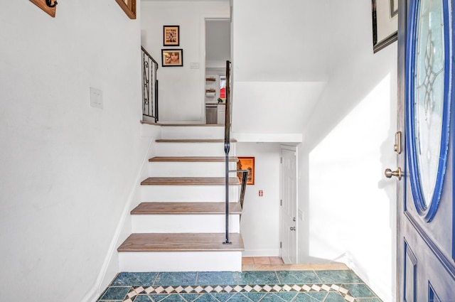 staircase with tile patterned flooring