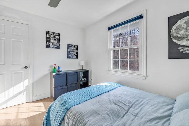 bedroom featuring hardwood / wood-style flooring and ceiling fan