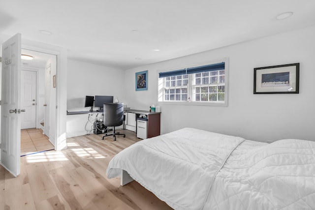 bedroom with light hardwood / wood-style floors