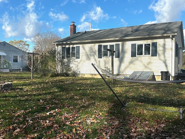 view of property exterior with a yard