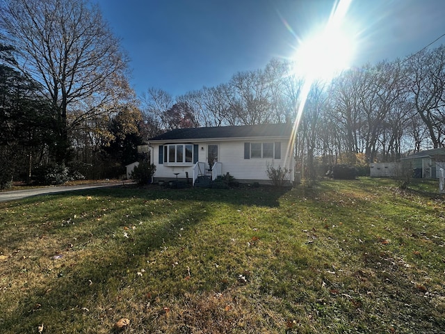 view of front of home with a front lawn