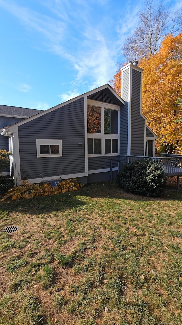 back of house featuring a yard