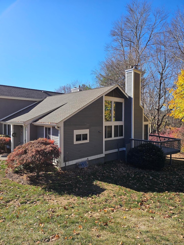 view of home's exterior featuring a yard