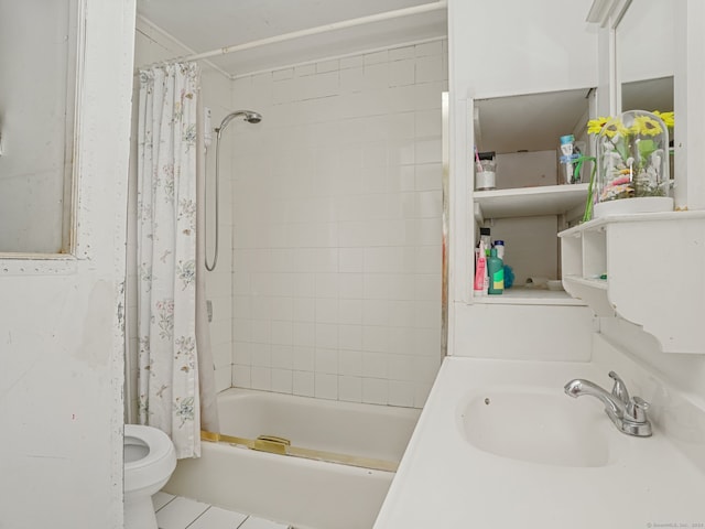 full bathroom with tile patterned flooring, shower / bath combo with shower curtain, sink, and toilet