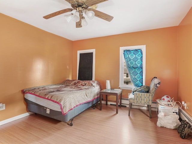 bedroom featuring ceiling fan and light hardwood / wood-style flooring