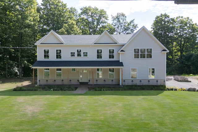 view of front of house featuring a front yard and a porch