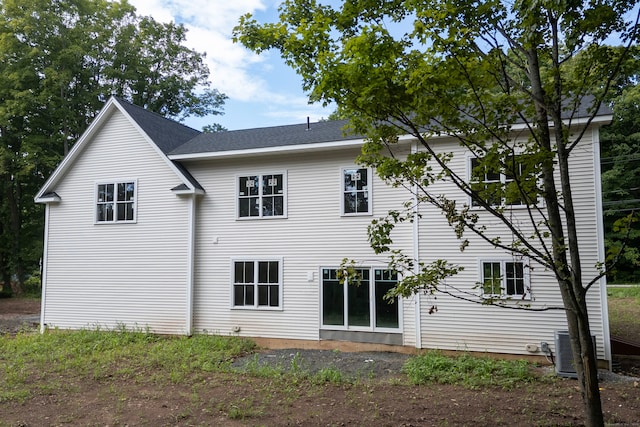 back of house featuring central AC