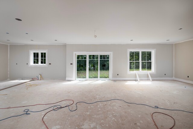 unfurnished living room featuring a healthy amount of sunlight