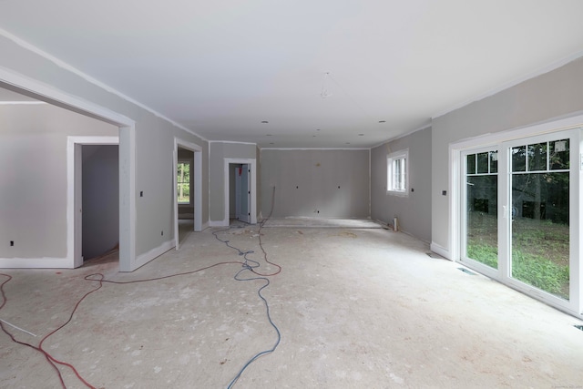 unfurnished living room featuring plenty of natural light